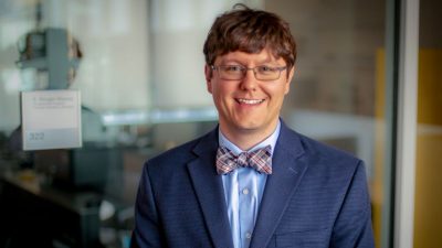 Aaron Noble in blue suit and bow tie