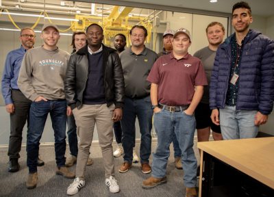 Students posing in the center for autonomous mining classroom