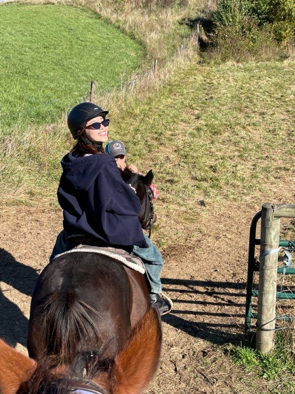 Yanan Pan riding a horse.