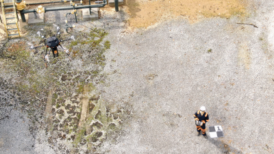 Student flying a drone.